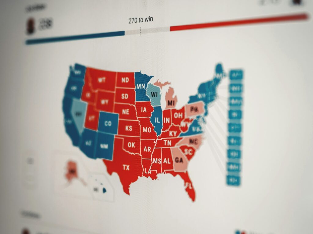 Image of the US elections map, states are filled in red or blue with a total vote count at the top.